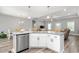 An open kitchen with a granite countertop, sink, and view into the dining and living areas at 1840 Willie Pace Rd, Burlington, NC 27217