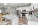 Bright, modern kitchen with stainless appliances, an island and granite countertops at 1840 Willie Pace Rd, Burlington, NC 27217