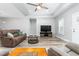 Bright living room showcases stylish floors, a comfortable sofa, and a modern entertainment center for relaxation at 1840 Willie Pace Rd, Burlington, NC 27217