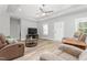 Bright and airy living room with hardwood floors, a comfortable seating arrangement, and modern decor at 1840 Willie Pace Rd, Burlington, NC 27217