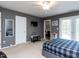 Spacious bedroom with neutral walls, large bed, ceiling fan, and access to the bathroom at 1909 Whirlaway Ct., Cary, NC 27519