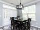 Elegant dining area with a modern chandelier and a large window at 1909 Whirlaway Ct., Cary, NC 27519