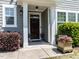 Inviting front porch with decorative planters and well-maintained landscaping at 1909 Whirlaway Ct., Cary, NC 27519