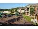 Community playground with colorful slides, swings, and well-manicured lawns next to buildings at 1909 Whirlaway Ct., Cary, NC 27519