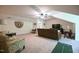 Bonus room with carpeting, ceiling fan, entertainment area, and comfortable seating at 197 W Paige Wynd Dr, Angier, NC 27501