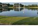Picturesque lake reflecting surrounding homes and a water tower at 197 W Paige Wynd Dr, Angier, NC 27501