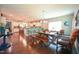Open-concept dining area connected to the kitchen with hardwood floors and stylish lighting at 197 W Paige Wynd Dr, Angier, NC 27501