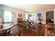 Open dining room with hardwood floors, wood table, bench seating and modern decor at 197 W Paige Wynd Dr, Angier, NC 27501