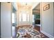 Bright entryway with hardwood floors and a stylish light fixture at 197 W Paige Wynd Dr, Angier, NC 27501