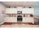 Bright kitchen features granite countertops, stainless steel appliances, and ample cabinet space at 197 W Paige Wynd Dr, Angier, NC 27501