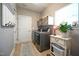 Functional laundry room with modern washer and dryer, storage, and natural light at 197 W Paige Wynd Dr, Angier, NC 27501