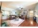 Spacious living room with hardwood floors, comfortable seating, and lots of natural light at 197 W Paige Wynd Dr, Angier, NC 27501