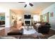 Inviting living room features a fireplace with mounted TV and comfortable leather seating at 197 W Paige Wynd Dr, Angier, NC 27501