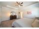 This main bedroom features a decorative mirror on top of a wooden dresser and soft carpet at 197 W Paige Wynd Dr, Angier, NC 27501