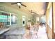 Spacious screened porch with ceiling fans, comfortable seating, and a dining area for outdoor enjoyment at 197 W Paige Wynd Dr, Angier, NC 27501