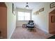 Cozy sitting area features natural light, a comfortable chair, and stylish décor at 197 W Paige Wynd Dr, Angier, NC 27501