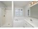 Bathroom with soaking tub, shower, white tile, and vanity at 2014 Silky Dogwood Trl, Apex, NC 27502