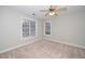 Bedroom with neutral paint, carpet, ceiling fan and two windows at 2014 Silky Dogwood Trl, Apex, NC 27502