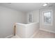 Upstairs hallway featuring neutral paint and natural light at 2014 Silky Dogwood Trl, Apex, NC 27502