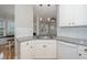 Modern kitchen with granite countertops, stainless steel sink and subway tile backsplash at 2014 Silky Dogwood Trl, Apex, NC 27502