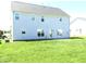 Spacious backyard with lush green grass and a patio area, ideal for outdoor enjoyment at 202 Redstone Ct, Gibsonville, NC 27249
