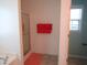 Bright bathroom with a shower stall, orange towels, and a window at 202 Redstone Ct, Gibsonville, NC 27249