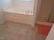 Bathroom featuring a soaking tub with tile flooring and a tiled in shower at 202 Redstone Ct, Gibsonville, NC 27249