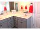 Bright bathroom with double sink vanity, neutral colors, and a mirror at 202 Redstone Ct, Gibsonville, NC 27249