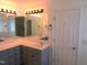 This bathroom has double sinks, storage, and a large mirror at 202 Redstone Ct, Gibsonville, NC 27249