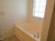 This bathroom features a bathtub with tile surround at 202 Redstone Ct, Gibsonville, NC 27249