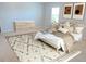 A bedroom with carpet floor, a bed with pillows, and two framed arts at 202 Redstone Ct, Gibsonville, NC 27249