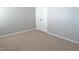 Bedroom features neutral carpet, light grey walls and a closet at 202 Redstone Ct, Gibsonville, NC 27249