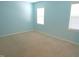 Bedroom with blue walls, neutral carpet, and two large windows at 202 Redstone Ct, Gibsonville, NC 27249