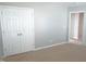 Bedroom with neutral carpet, closet, and light grey walls at 202 Redstone Ct, Gibsonville, NC 27249