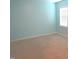 Bedroom features blue walls, neutral carpet, and a single large window at 202 Redstone Ct, Gibsonville, NC 27249