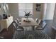 Dining room features a long wooden table and eight chairs and a long accent table at 202 Redstone Ct, Gibsonville, NC 27249