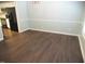 Dining room features hardwood floors, chair rail detail, and chandelier at 202 Redstone Ct, Gibsonville, NC 27249