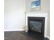 Close up of fireplace with black granite hearth at 202 Redstone Ct, Gibsonville, NC 27249