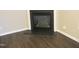 Corner view of cozy fireplace with mantel, set in a room with updated hardwood floors at 202 Redstone Ct, Gibsonville, NC 27249