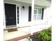 Inviting front entrance with a classic door and manicured landscaping at 202 Redstone Ct, Gibsonville, NC 27249