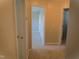 Hallway with neutral paint and carpeting that provides access to rooms at 202 Redstone Ct, Gibsonville, NC 27249