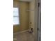 The laundry room features tile floors, a window, and hookups at 202 Redstone Ct, Gibsonville, NC 27249