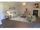 Inviting living room with hardwood floors, fireplace, and a cozy seating area with stylish decor at 202 Redstone Ct, Gibsonville, NC 27249
