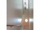 Bright staircase with a unique, round window and chandelier at 202 Redstone Ct, Gibsonville, NC 27249