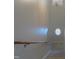 A neutrally painted stairwell is illuminated by a charming window and hanging light fixture at 202 Redstone Ct, Gibsonville, NC 27249