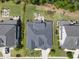 An aerial view shows a well-maintained yard with a patio fire pit and a playground at 2086 Amalfi Pl, Apex, NC 27502
