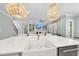 Open kitchen featuring a large island with a farmhouse sink, pendant lighting, and stainless steel appliances at 2086 Amalfi Pl, Apex, NC 27502