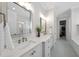 Spacious main bathroom with double vanity sinks, walk-in shower, and walk-in closet at 2086 Amalfi Pl, Apex, NC 27502