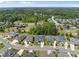 A scenic aerial view of a planned neighborhood featuring beautiful homes and winding roads at 2086 Amalfi Pl, Apex, NC 27502