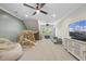 Bright playroom featuring a climbing structure, beanbag chair and a large flatscreen TV at 2086 Amalfi Pl, Apex, NC 27502